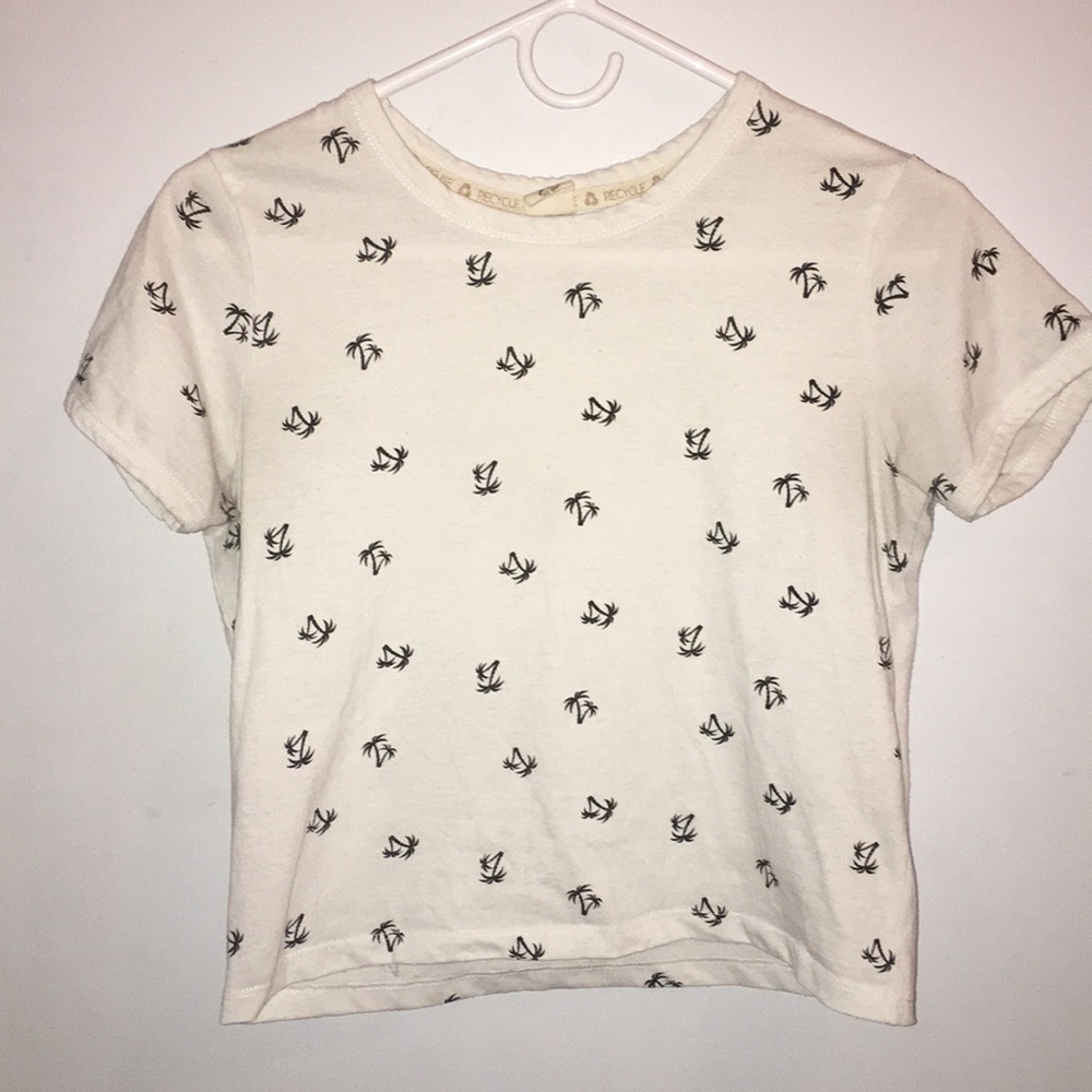A white palm tree print crop top
